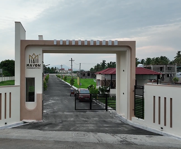 Secure residential plots with walking paths, clubhouse, gym, and clear legal titles.