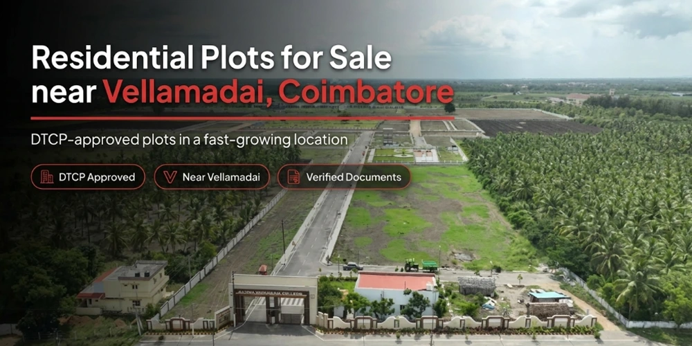 An aerial view of a gated land development project with an entrance gate surrounded by greenery.
