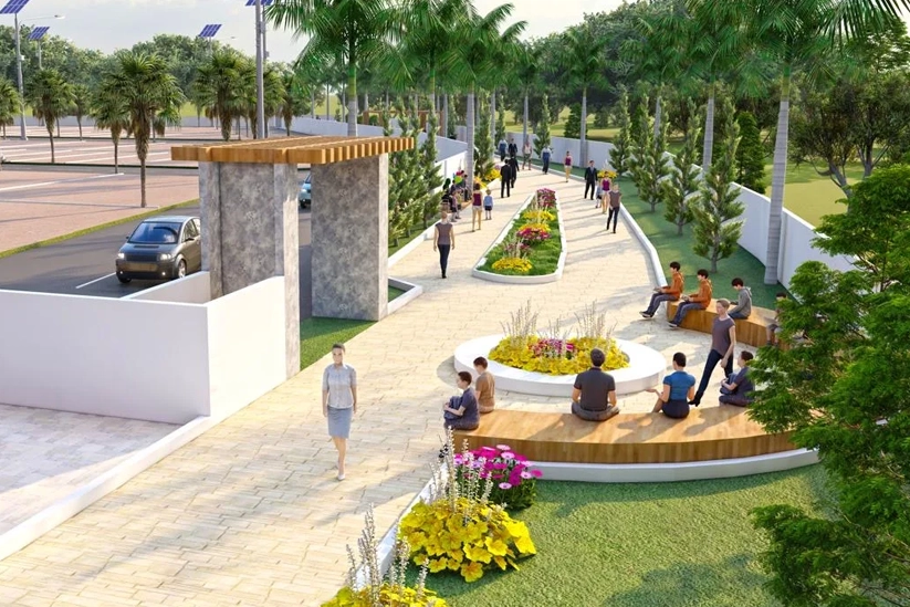 Landscaped walking area with benches, garden, & people relaxing in Kovilpalayam, Coimbatore